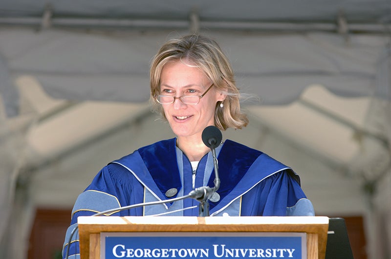  A low angle shot shows Ann Sarnoff standing at a podium and delivering commencement address to the McDonough School of Business class of 2006.