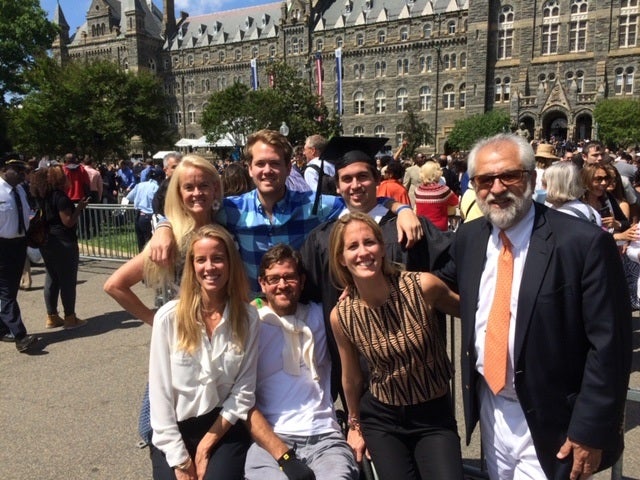 Rolando Gonzalez-Bunster stands in front of Healy Hall with his family at Diego Gonzalez-Bunster's graduation.