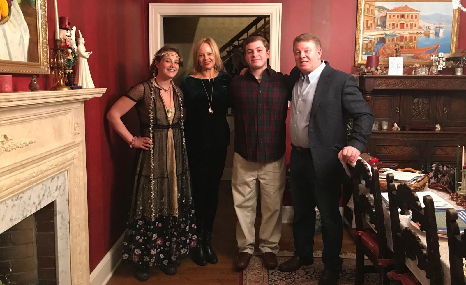 Claire, Rebekah, Paul Jr., and Paul Simpson standing together in their Ridgewood, New Jersey home.
