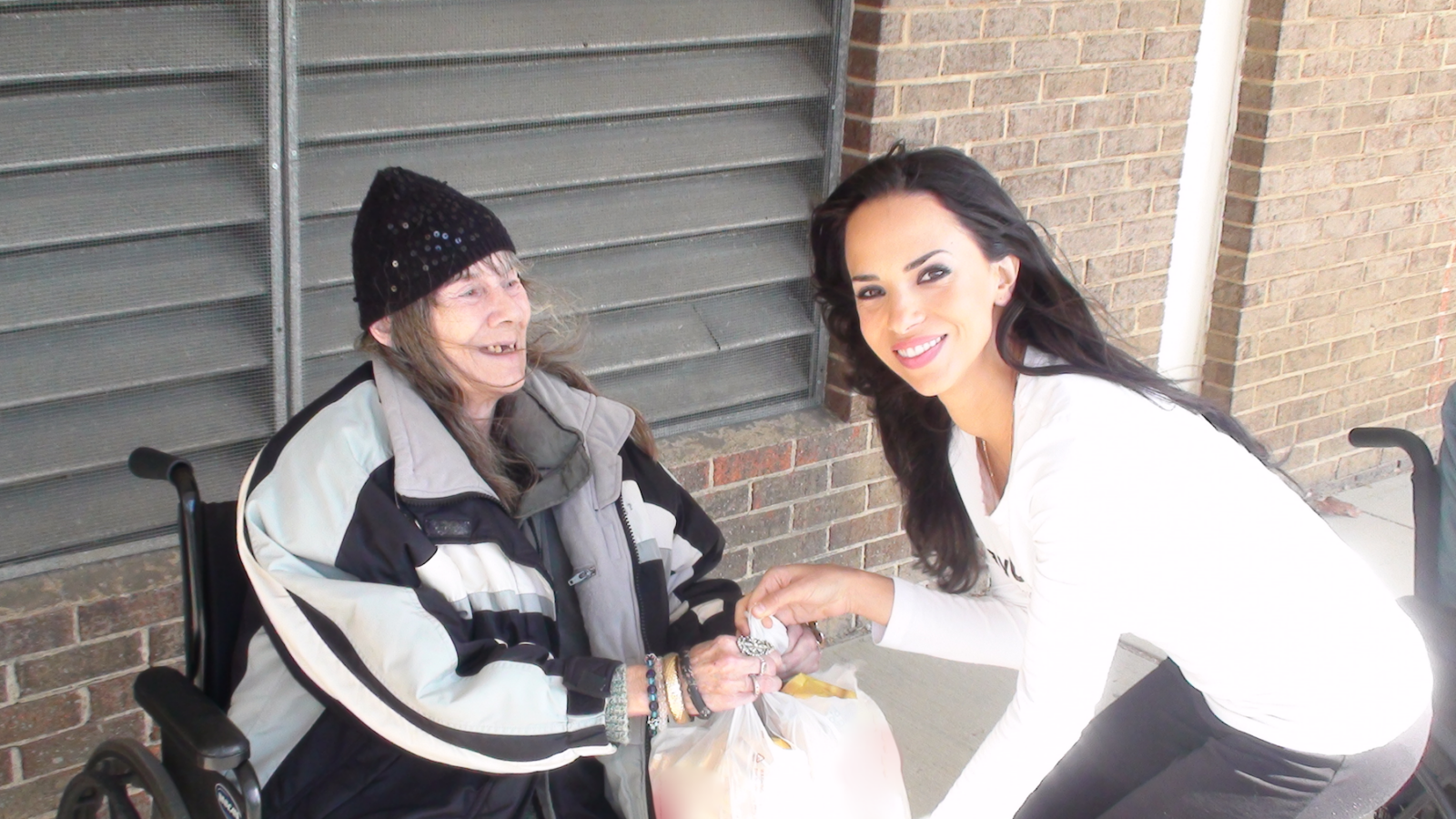 Ismini with a local woman in Wilmington, Del.
