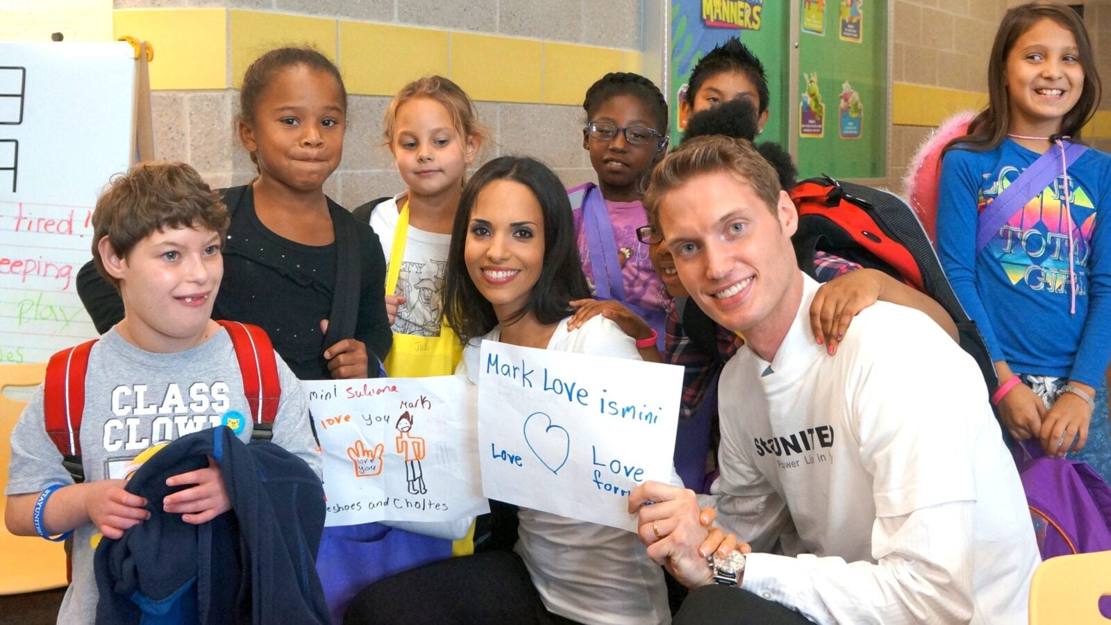 The couple visits Rhode Island School for the Deaf to meet with hearing impaired children.