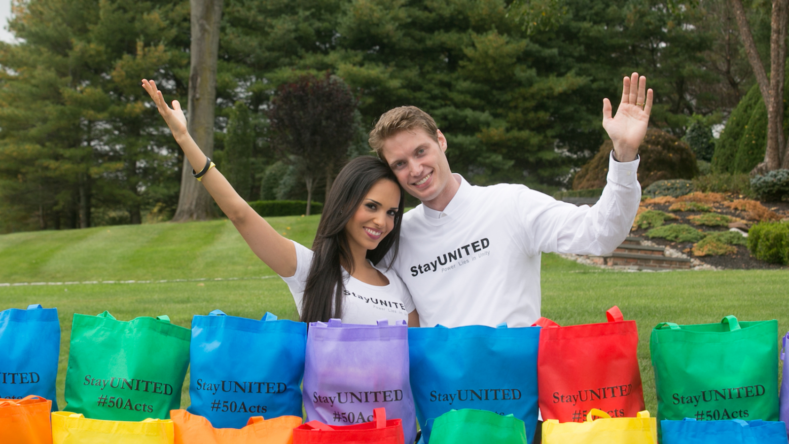 The Svenssons posing by colorful bags