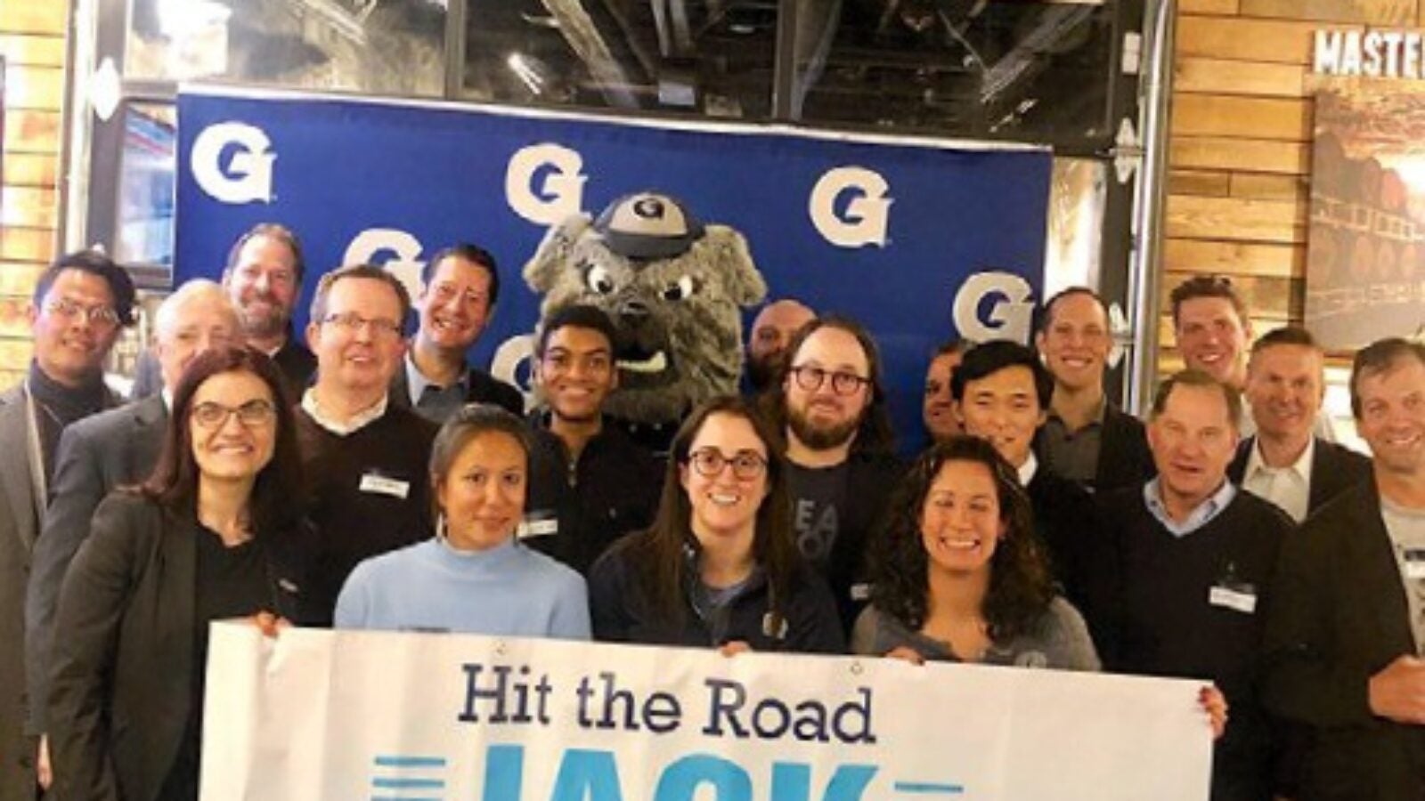 jack posing with alumni in detroit