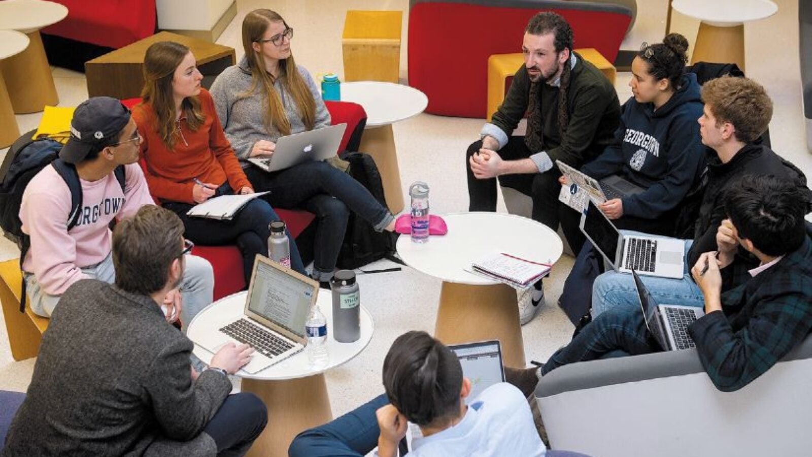 Professor Matthew Pavesich, lower left, leads a public humanities class at the School of Continuing Studies downtown location.