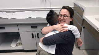 Eliza Uster embraces a patient