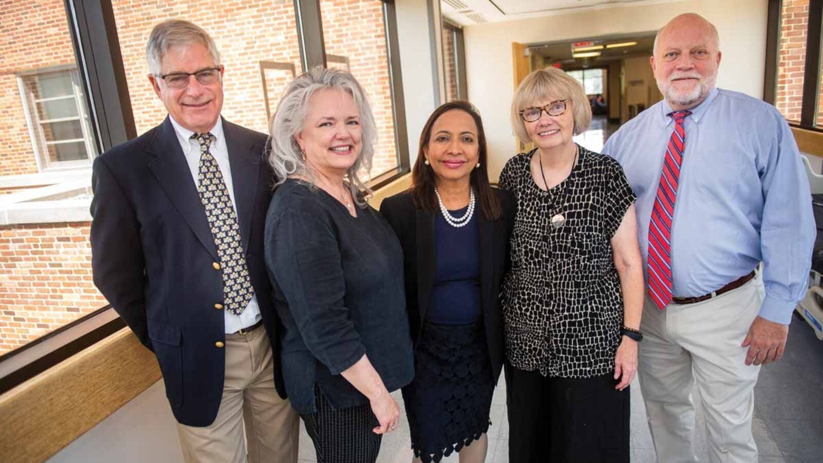 Current and former Georgetown colleagues in HIV and AIDS care who shared their memories for this article: Phil Pierce, Ella Curry, Princy Kumar, Mary Young, and Chip Read. Not pictured: Sal Jordan, S.J.