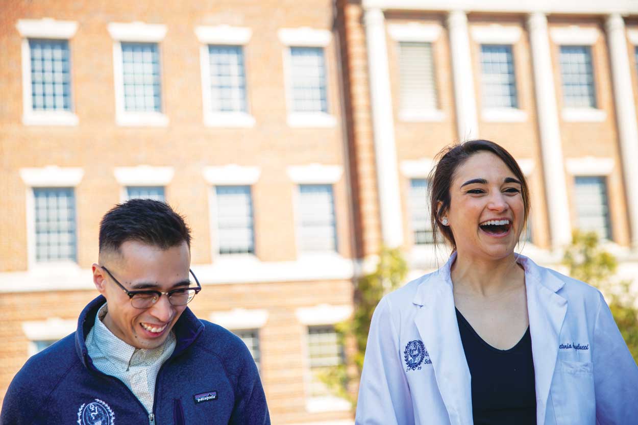 Medical students Jose Alejandro Almario (M’22) and Victoria Angelucci (M’19) laughing