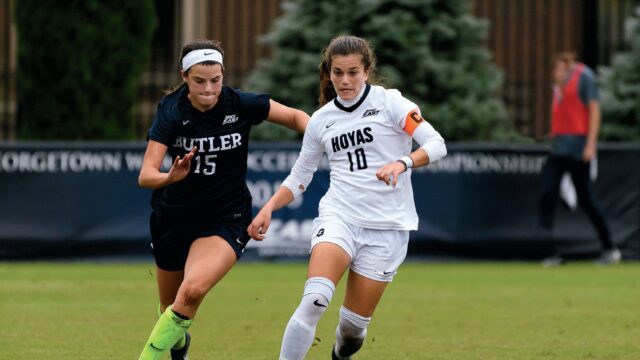 georgetown women's soccer player dribbling