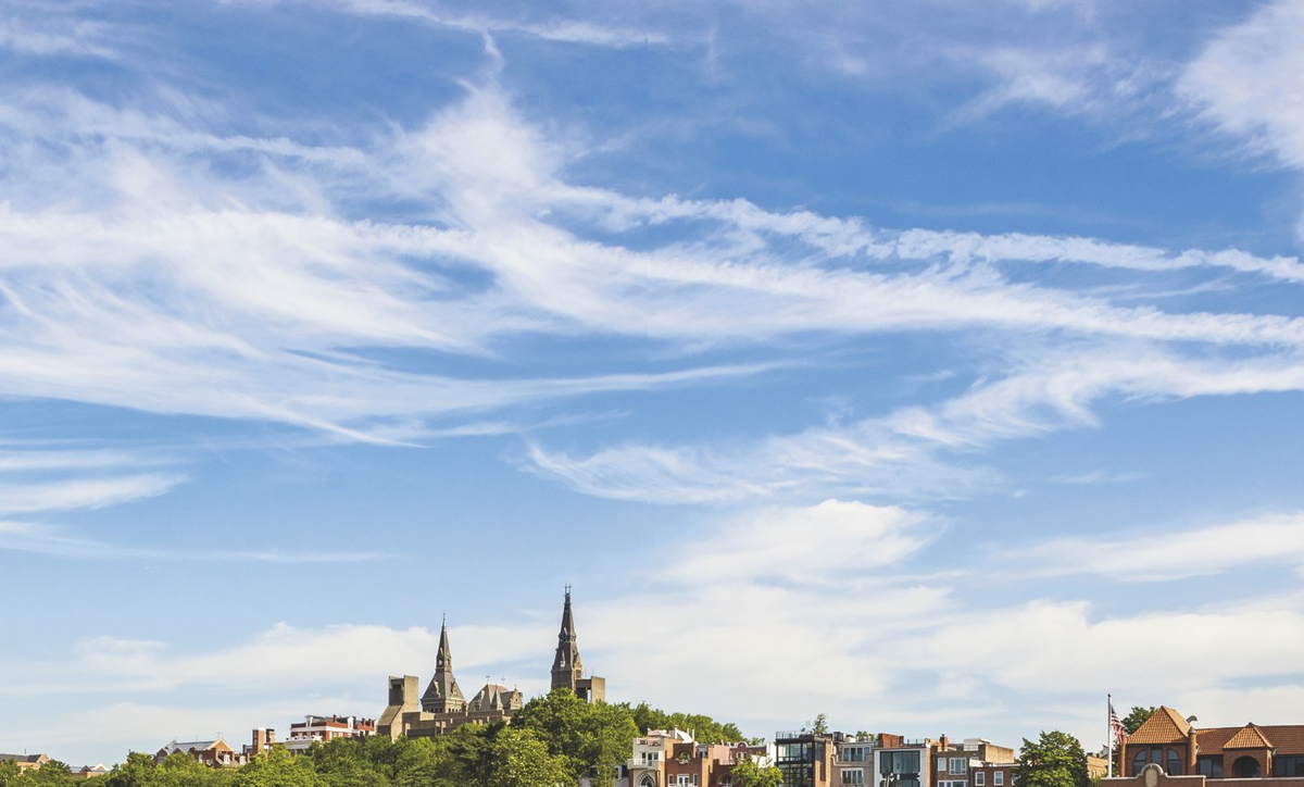clouds over hilltop crop