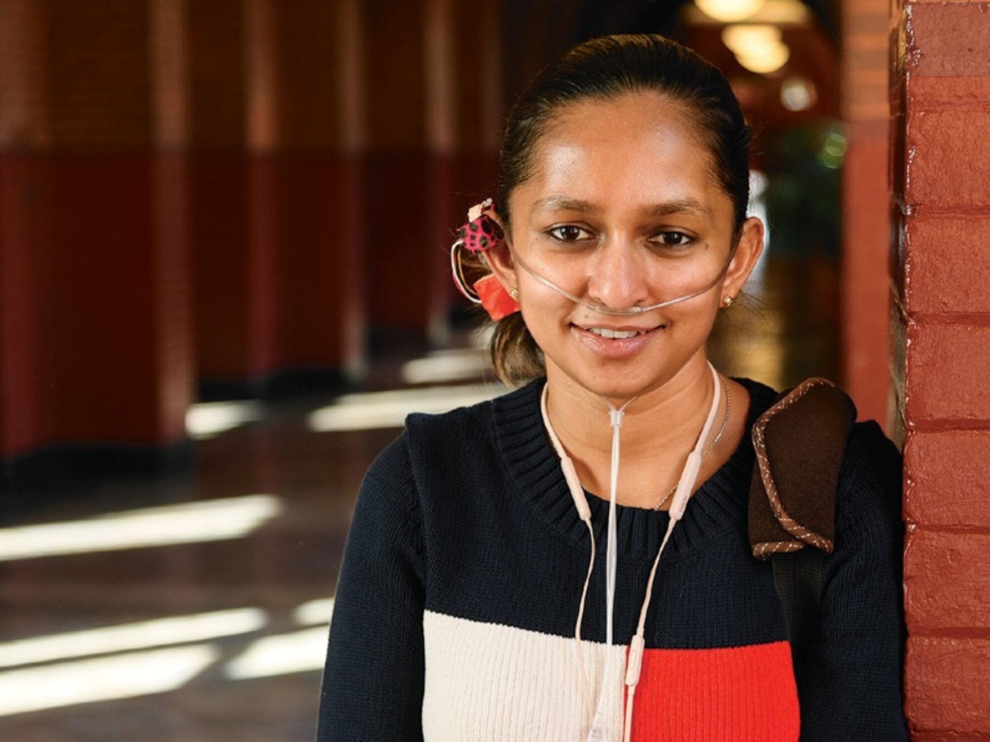 Shavini Fernando (G’18) wears a first-level prototype of OxiWear, her invention to alert users with pulmonary hypertension when their oxygen levels drop critically low. Fernando has the condition herself.