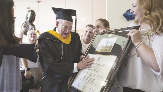 Carlos Manuel Sera with diploma