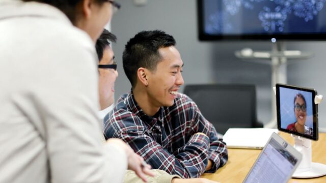 L-R: Prof. Yianna Vovides and students Andrew Zubiri, Aaron Joya, and Anne Jillian Dumanat (on screen from Doha, Qatar) discuss how people learn with technology during their fall 2019 Methods of Learning and Design course. | Photo: Moruomi Li