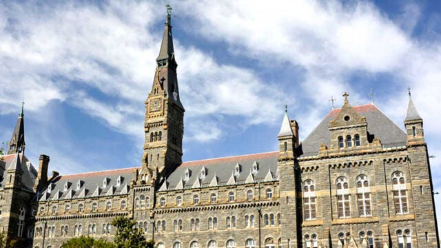 healy hall with blue skies anc clouds behind
