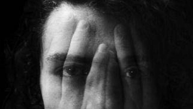 image of face with transparent hands over it