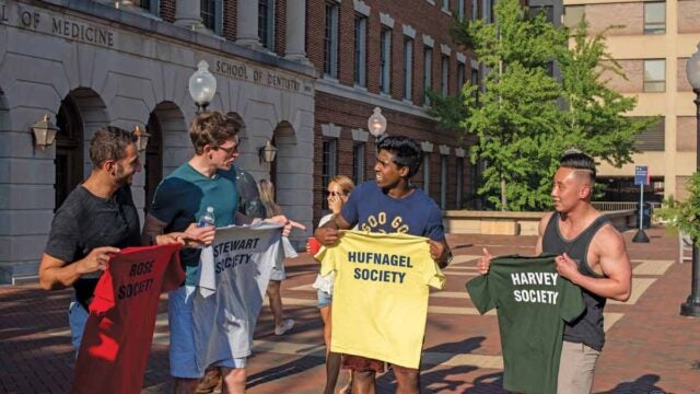 some bros posing together with tshirts