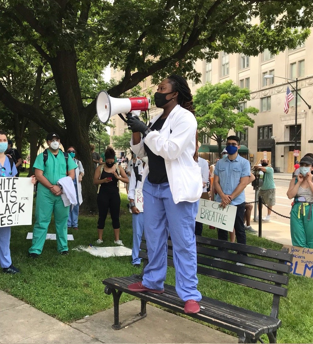 Jennifer Gyamfi Holiday (M’22) speaks to health care providers on June 6 at McPherson Square in Washington, D.C., before a White Coats for Black Lives protest at the White House. She spoke on how anti- Black racism and white supremacy are institutionalized in medicine and urged providers to combat implicit biases.