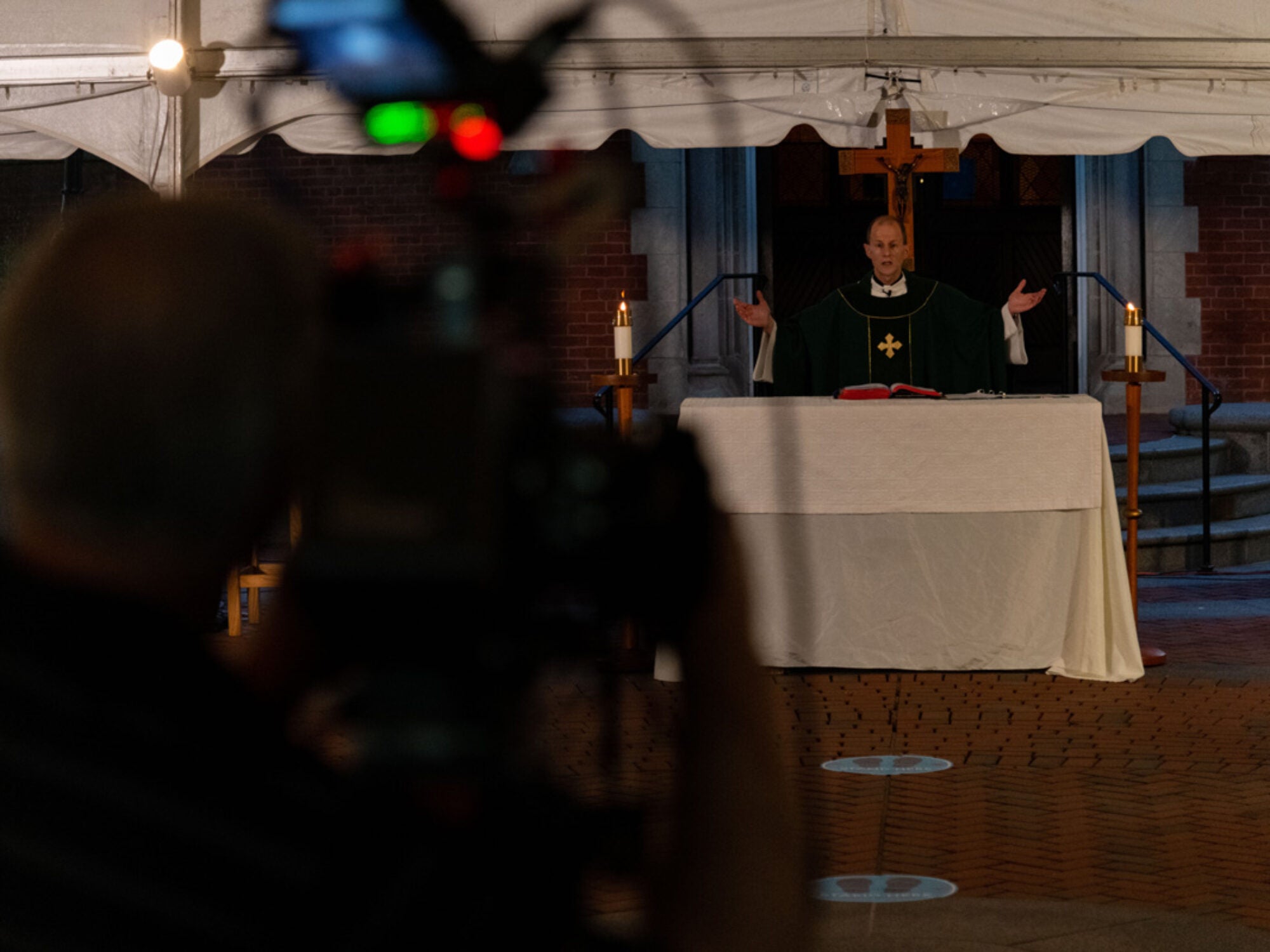 rev. matt carnes, S.J. leads a sunday mass broadcast via facebook live