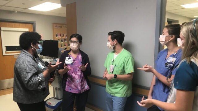 Rev. Taylor meets with the nursing team