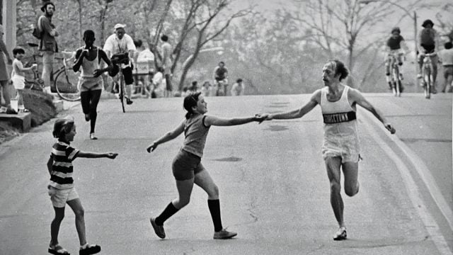 Jack Fultz at Boston Marathon being handed water