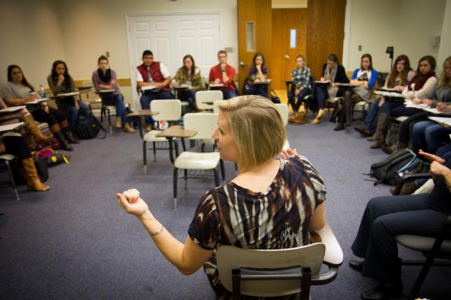 Andria Wisler, Ph.D., facilitates a class dialogue in Introduction to Justice and Peace.