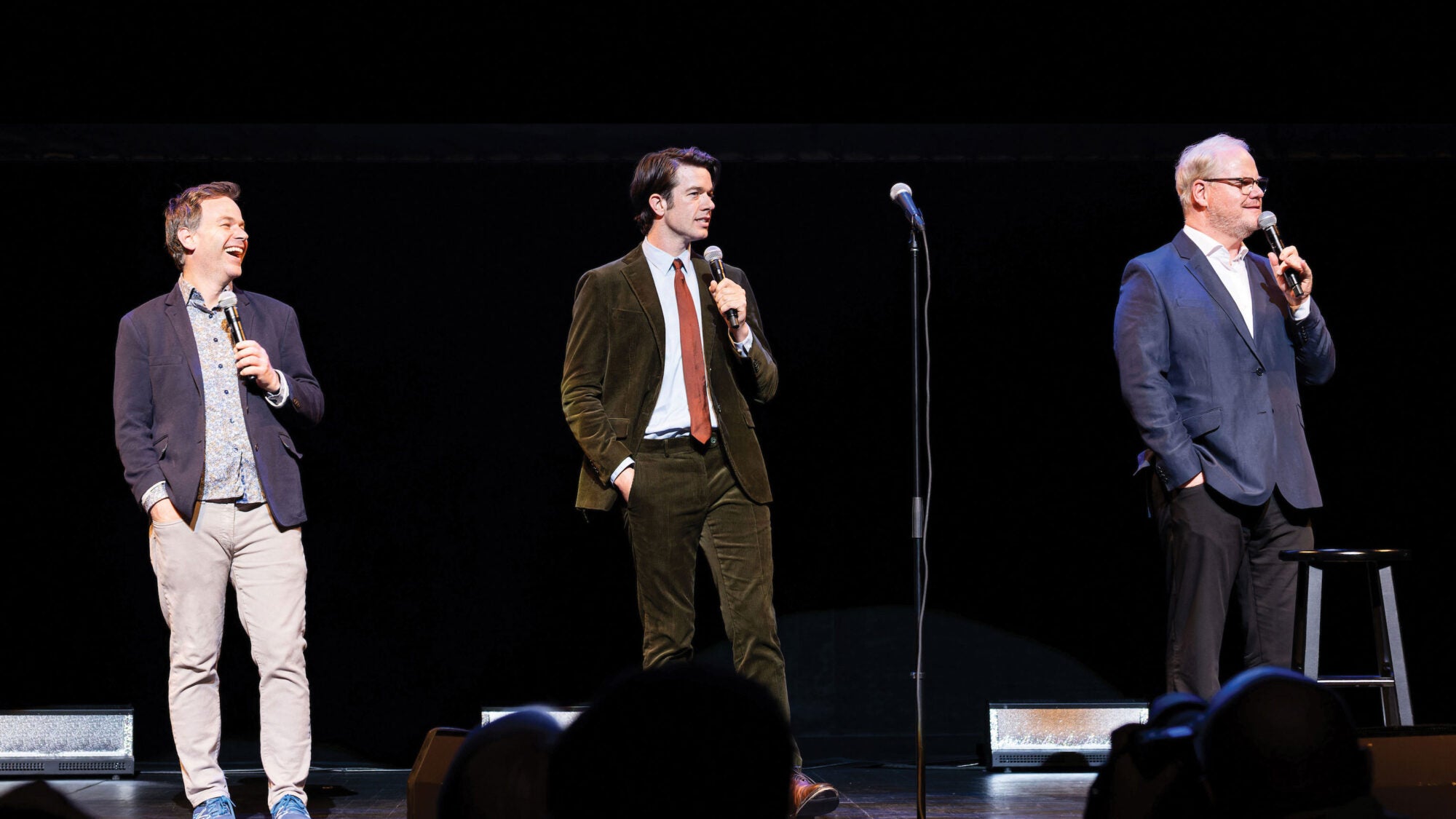 Comedians Mike Birbiglia (C’00), John Mulaney (C’04), and Jim Gaffigan (B’88, Parent’26) perform to a sold-out crowd at the second annual Stand Up for Georgetown fundraising event. | Photo: Jonathan Heisler