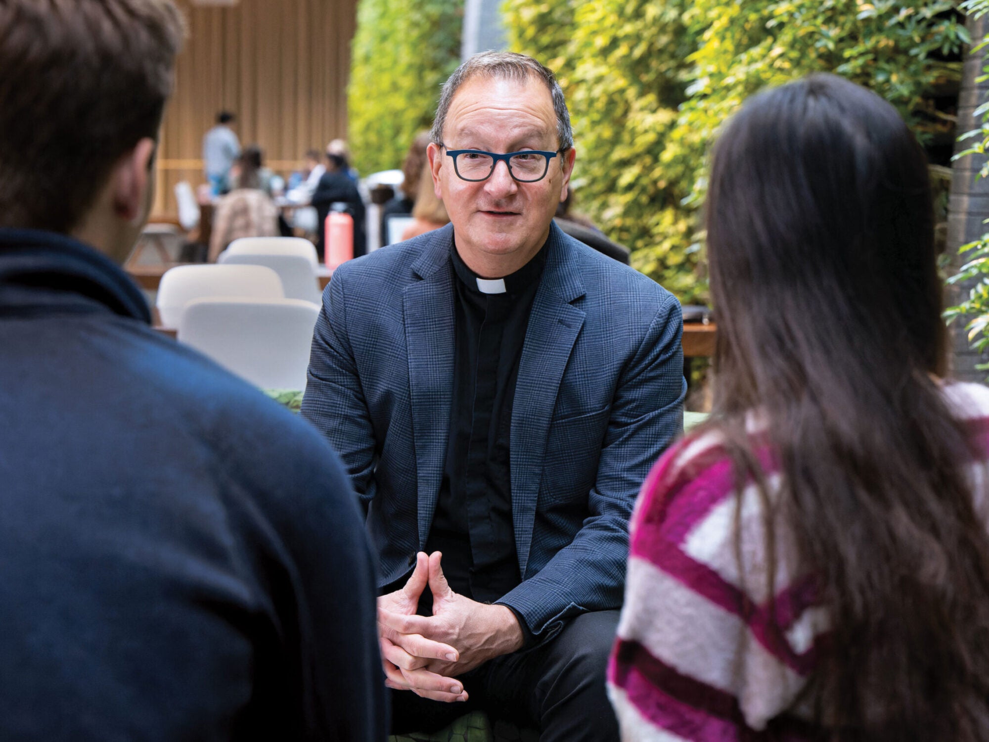 father bosco talking to students