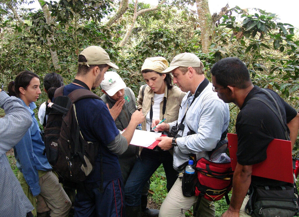 Pete Marra teaches students while out in the field.