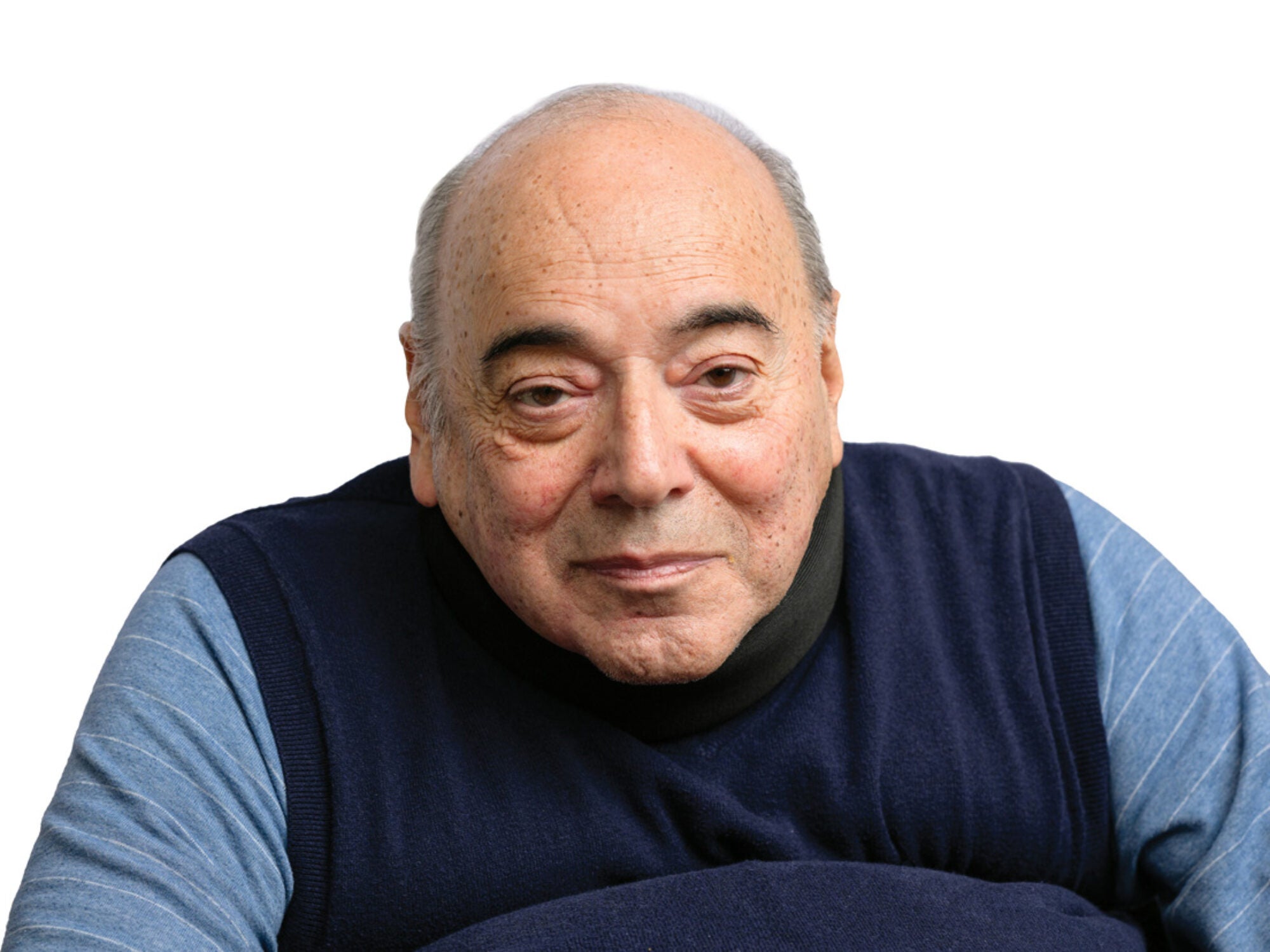 a man in a black vest and blue shirt