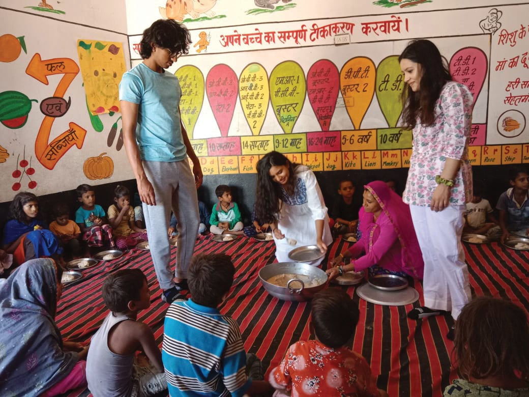 three college students teach young children