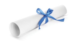 a rolled diploma with a blue ribbon
