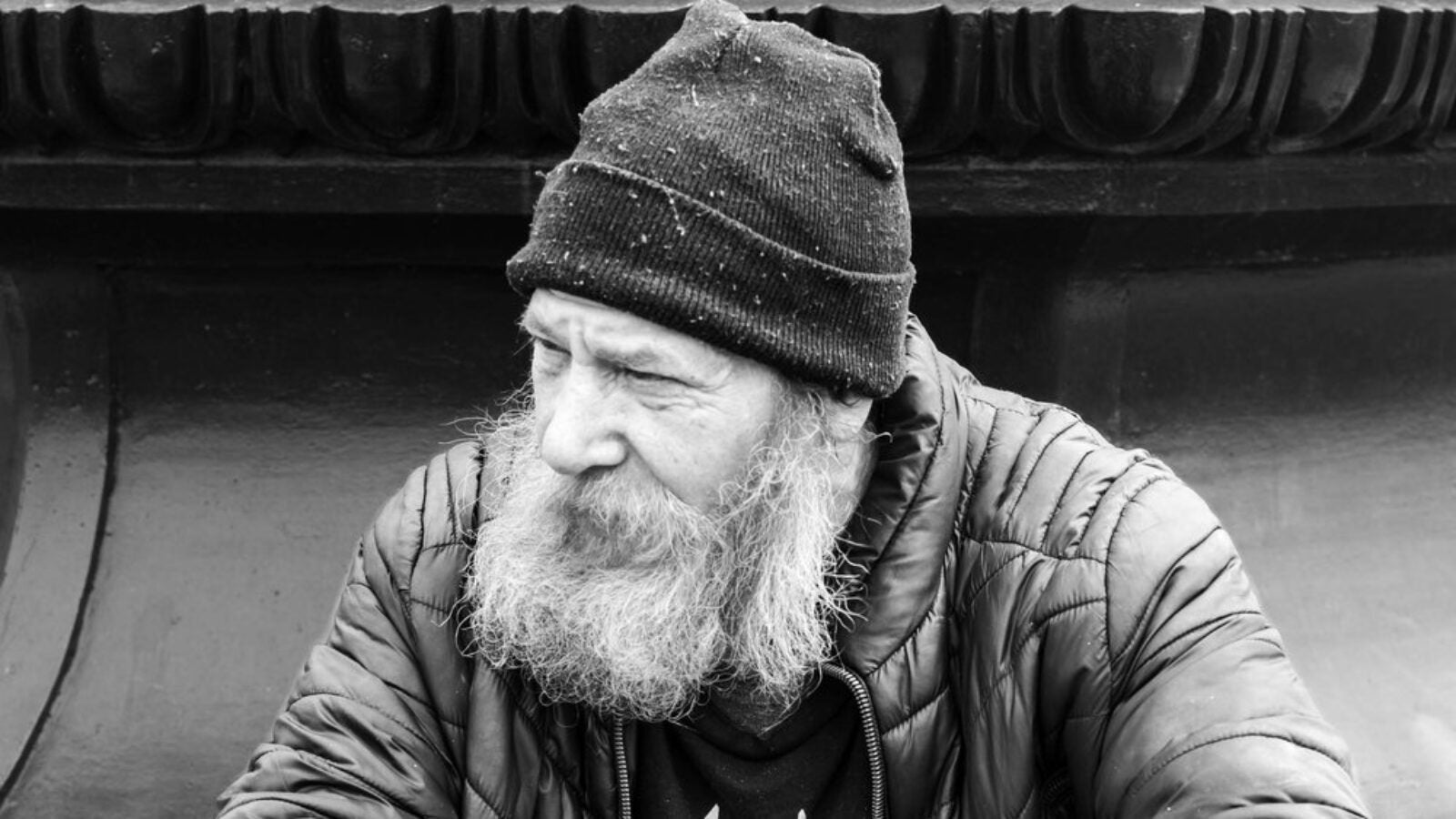 homeless man sitting