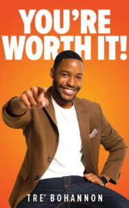 Against an orange background, a happy man points to the camera with the words "you're worth it" in white