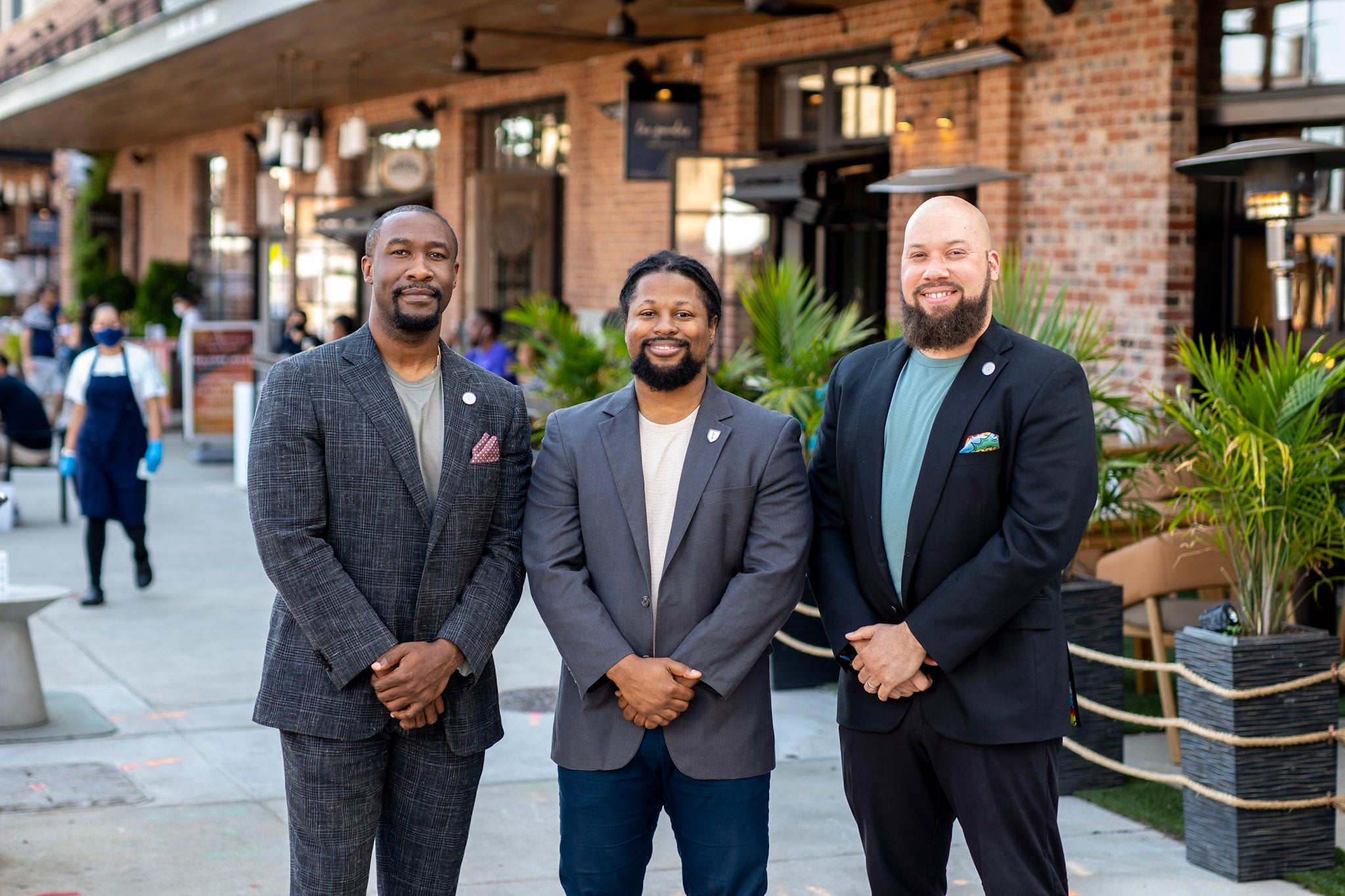 three men in dark suits