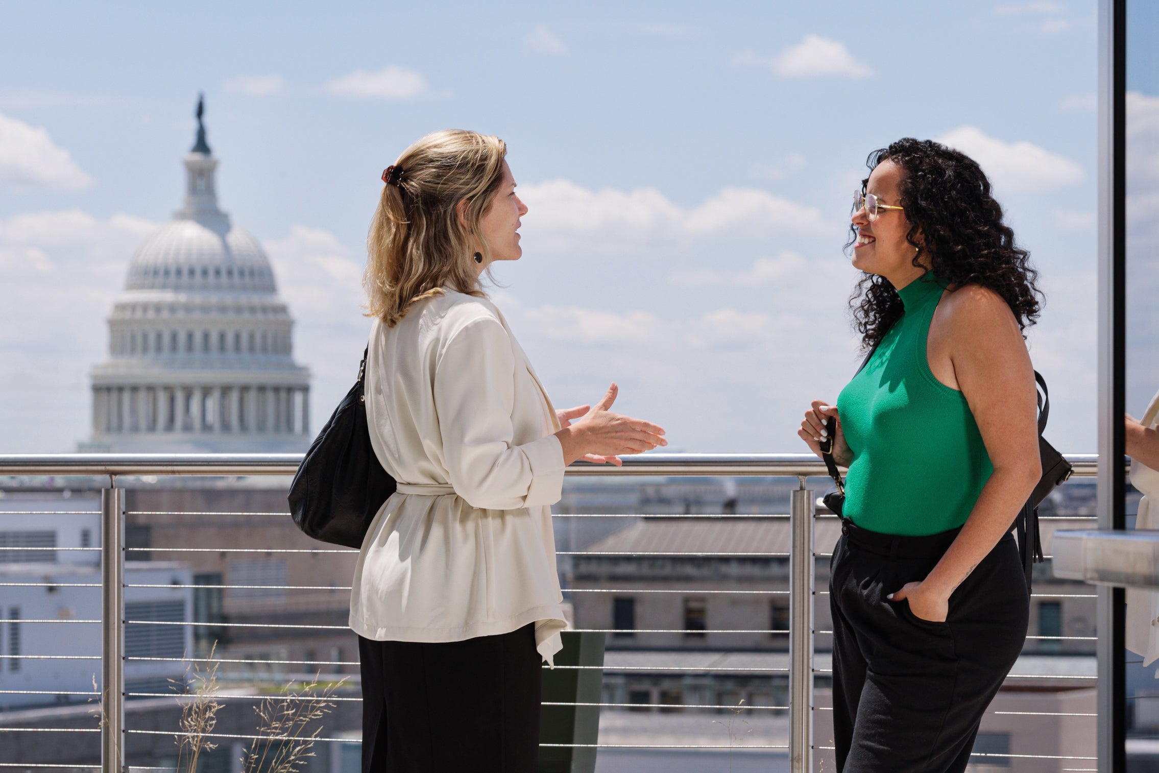 students talking with capitol building in background