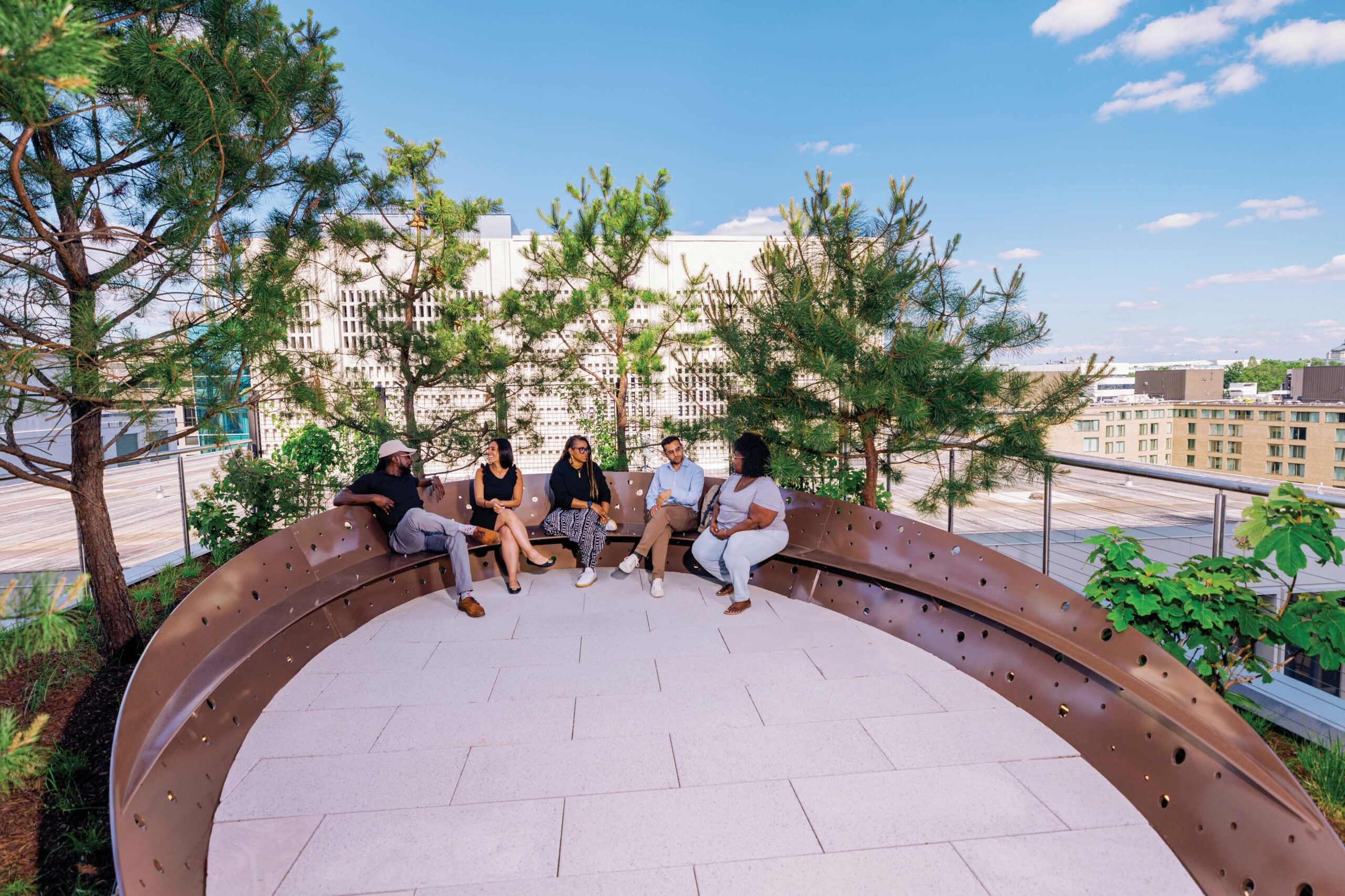 students sitting outside on bench