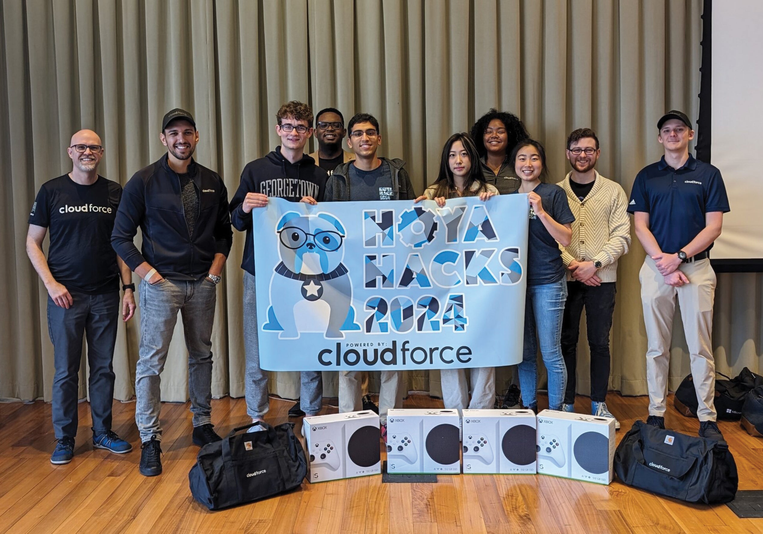 At Hoya Hacks 2024, Annika Lin (C’24), Maggie Shen (B’22), Reed Uhlik (C’25), and Sameer Tirumala (B’25) were awarded the Cloudforce-Microsoft AI Track Prize and second place overall prize for HoyaHelper, a virtual admissions bot to help prospective students learn about the university. | Photo: Courtesy of Hoya Hacks