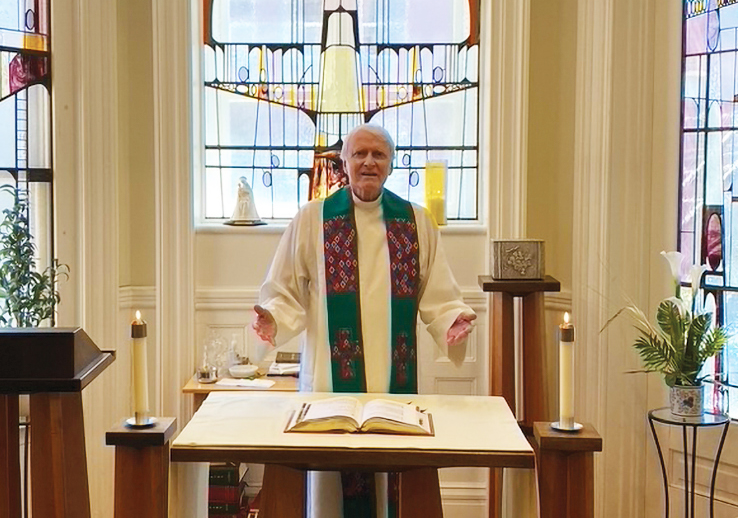 a man in religious clothing stands at a pulpit