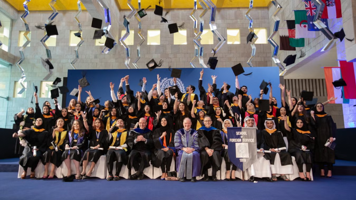 jack degioia with students at graduation