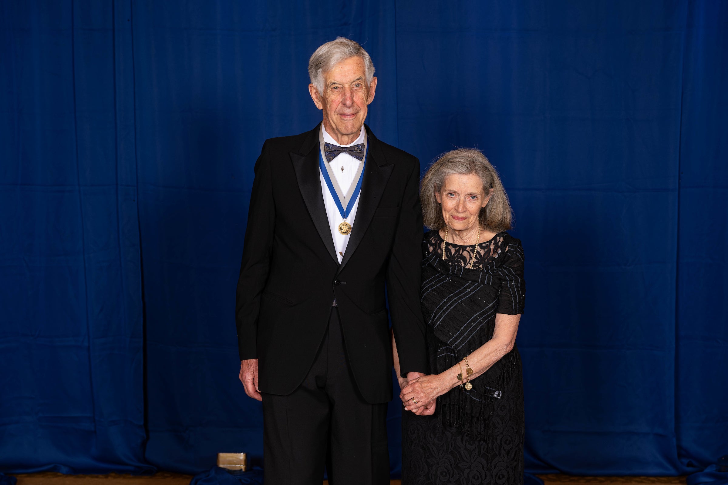 a man and a woman in formal wear
