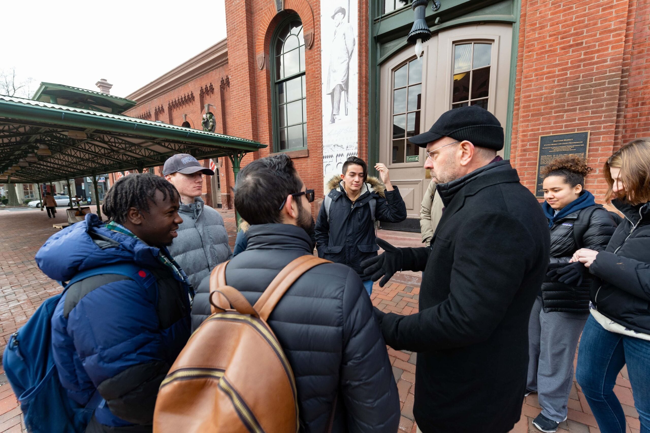 professor talking to students outside