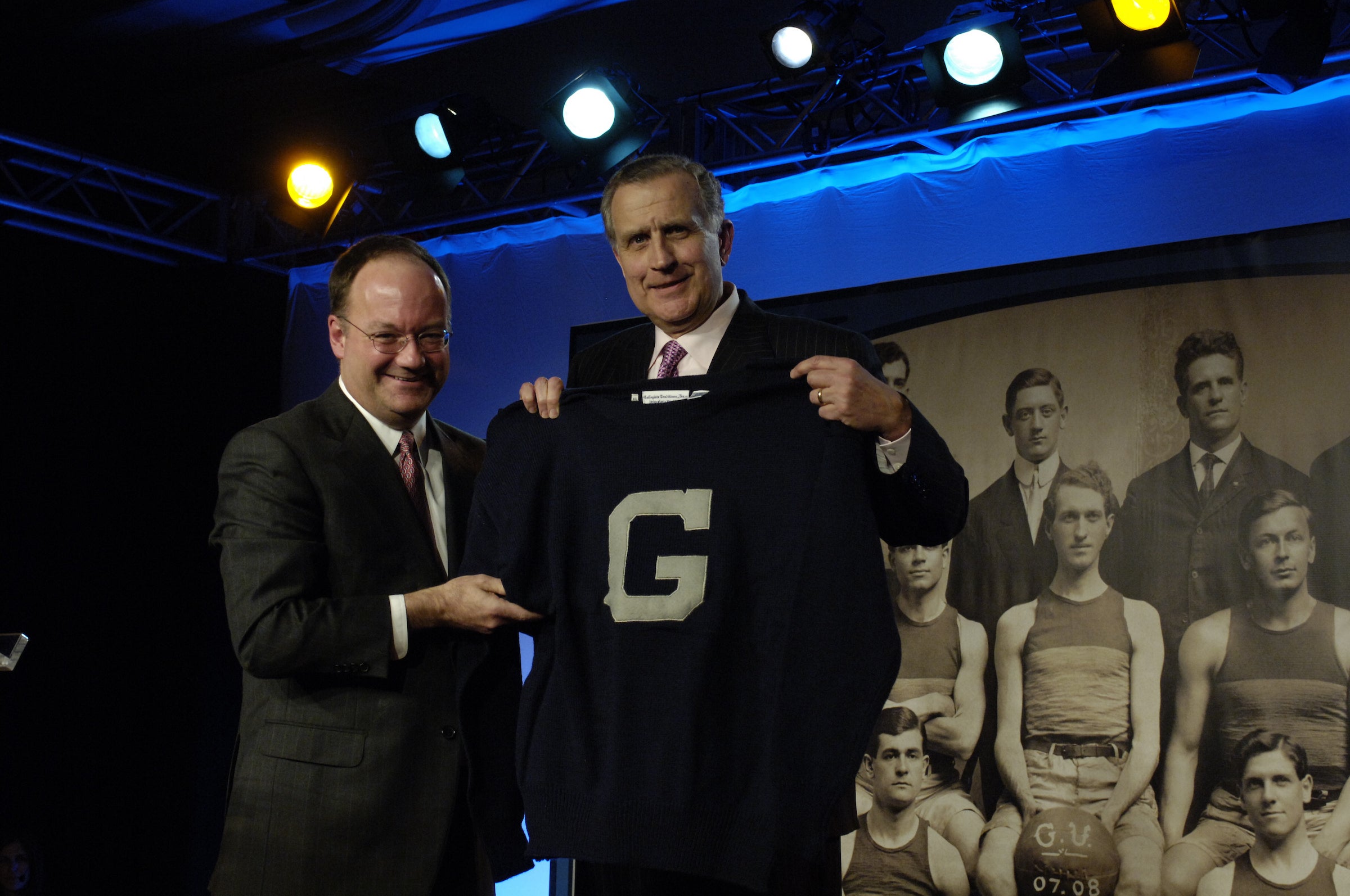 jack degioia and paul tagliabue posing with a georgetown shirt
