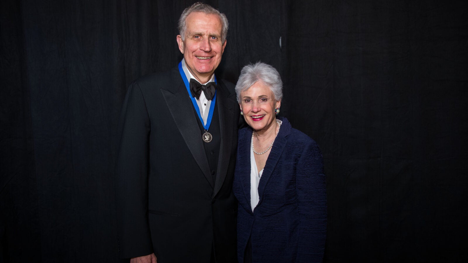paul tagliabue and his wife posing