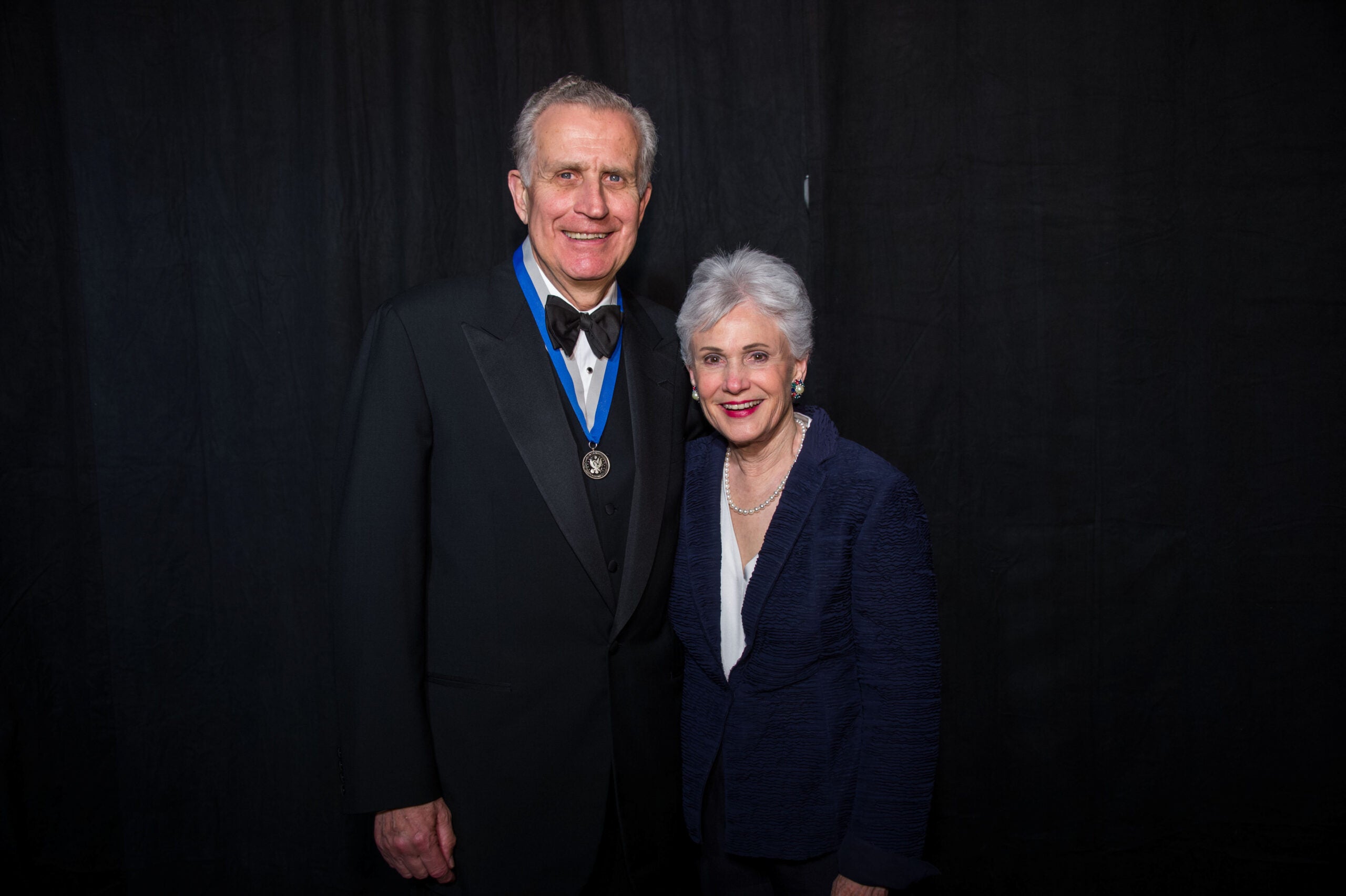 paul tagliabue and his wife posing
