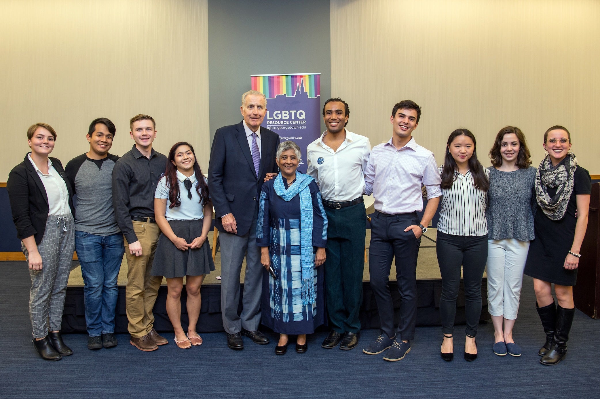 paul tagliabue posing with the LGBTQ center and students