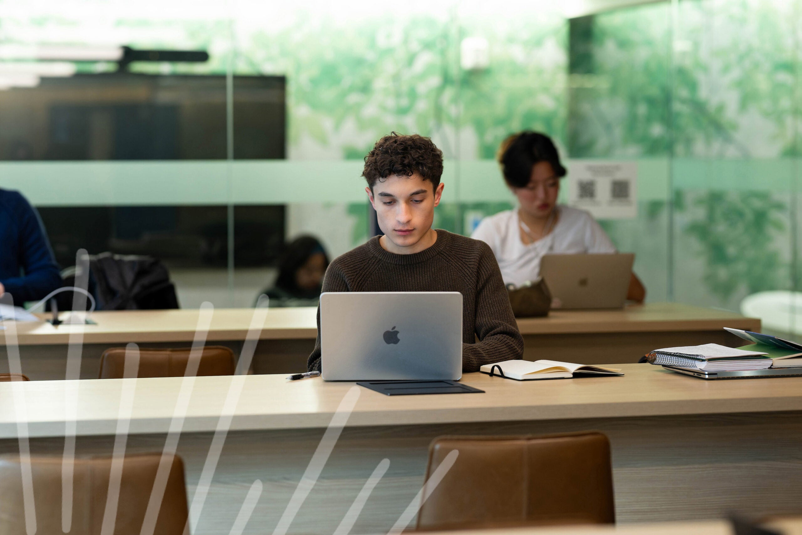 The ground floor of Byrnes Hall serves as a light-filled study and social space for residents like Sajan Blum (B’27), a finance and accounting major who plays on the ultimate frisbee team.