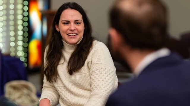 Anna Harty talking with someone and smiling