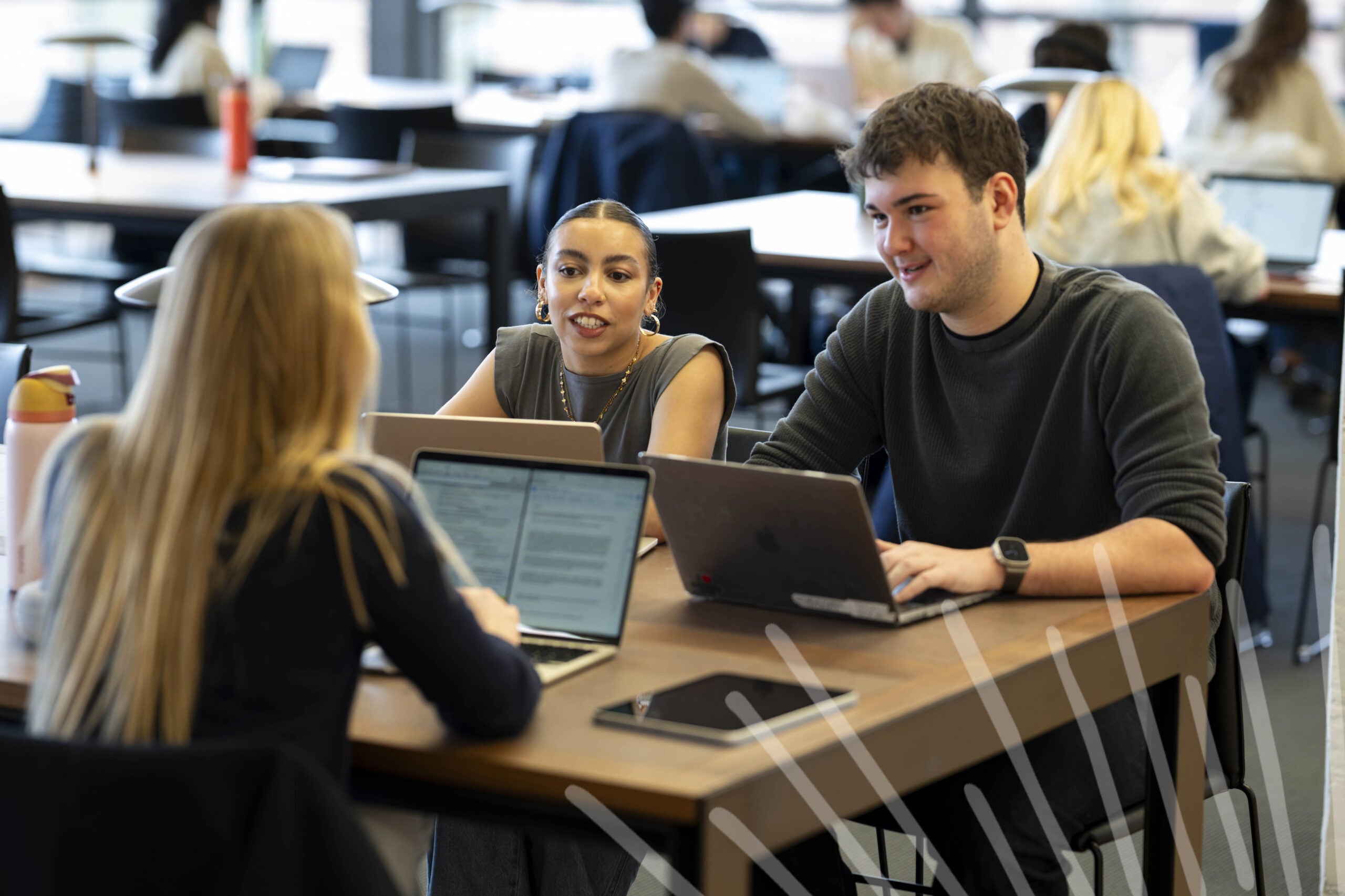 students sitting at table talking