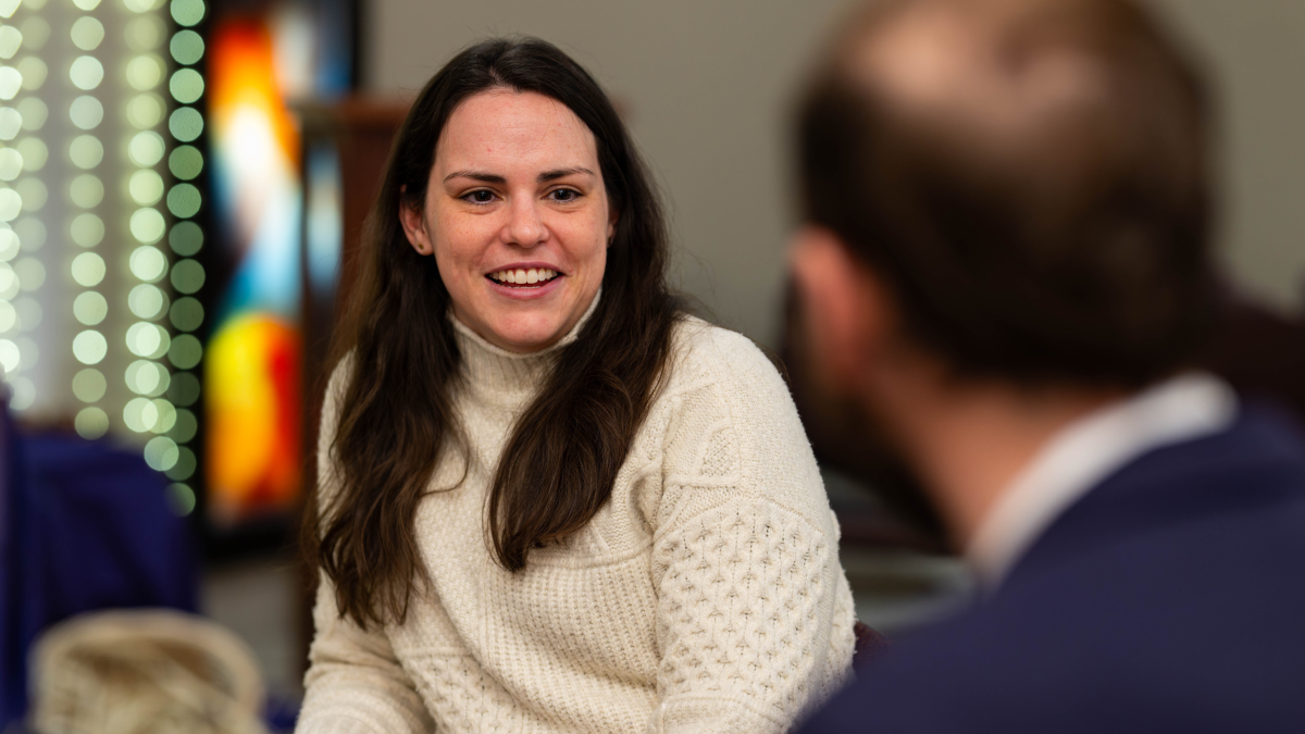 Anna Harty talking with someone and smiling