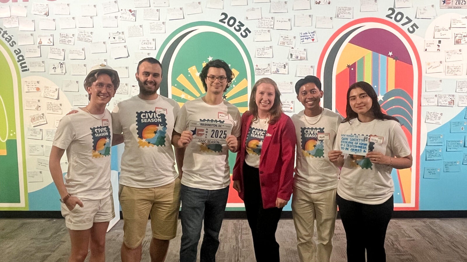 Caroline Klibanoff and her Civil Season team—including fellow Hoyas Joseph “Scottie” Vandy (C’27) and Wyatt Nako (C’26)—celebrate the U.S. 250th celebration in front of the Wish Wall mural at the Smithsonian’s National Museum of American History.