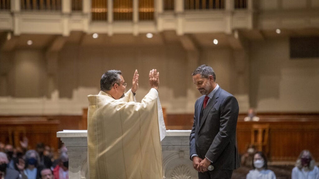 Peñalver receives a blessing at a Mass celebrating his inauguration as the president of Seattle University at St. James Cathedral in Seattle, Washington, on Sept. 23, 2021.